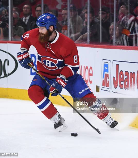 Jordie Benn of the Montreal Canadiens looks to pass the puck against the New York Rangers in Game Five of the Eastern Conference Quarterfinals during...