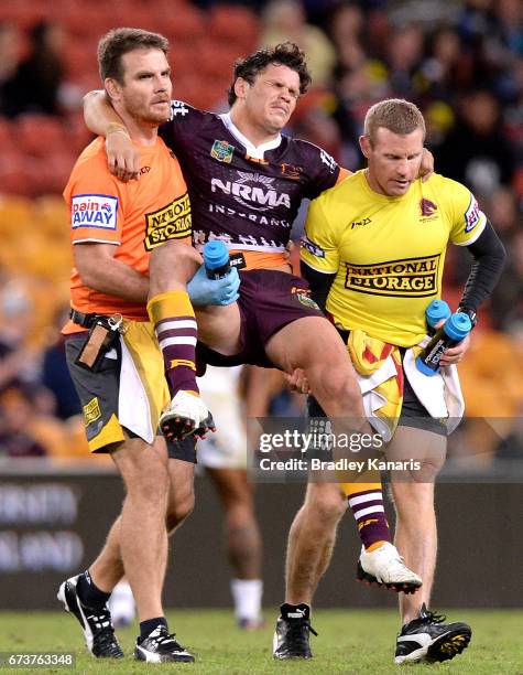 James Roberts of the Broncos is taken from the field injured during the round nine NRL match between the Brisbane Broncos and the Penrith Panthers at...