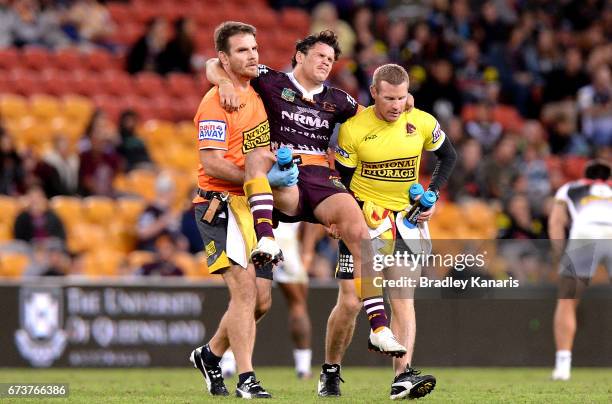 James Roberts of the Broncos is taken from the field injured during the round nine NRL match between the Brisbane Broncos and the Penrith Panthers at...