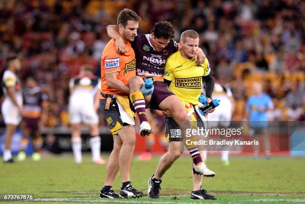 James Roberts of the Broncos is taken from the field injured during the round nine NRL match between the Brisbane Broncos and the Penrith Panthers at...