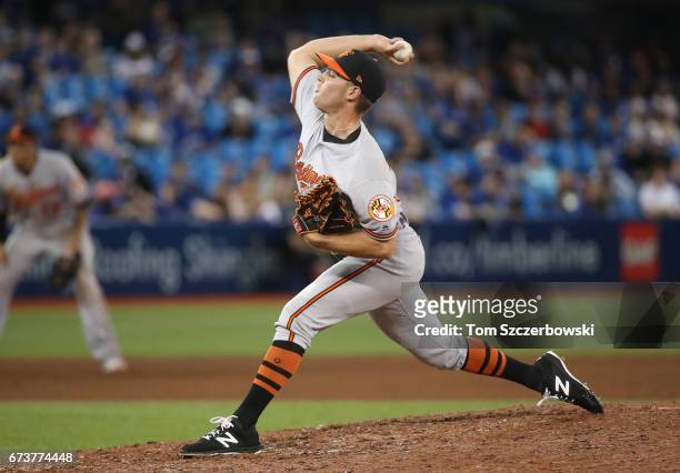 Tyler Wilson of the Baltimore Orioles delivers a pitch in the eighth inning during MLB game action against the Toronto Blue Jays at Rogers Centre on...