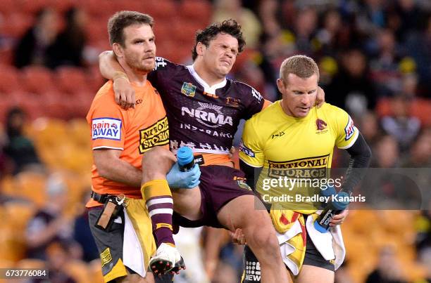 James Roberts of the Broncos is taken from the field injured during the round nine NRL match between the Brisbane Broncos and the Penrith Panthers at...