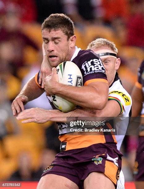 Andrew McCullough of the Broncos attempts to break free from the defence during the round nine NRL match between the Brisbane Broncos and the Penrith...