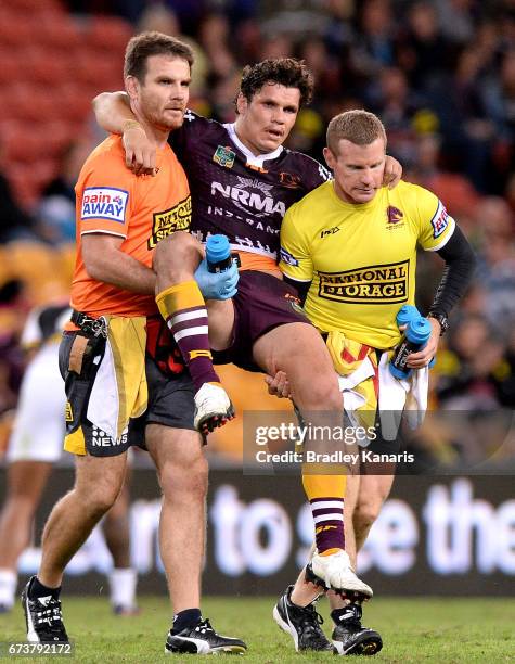 James Roberts of the Broncos is taken from the field injured during the round nine NRL match between the Brisbane Broncos and the Penrith Panthers at...