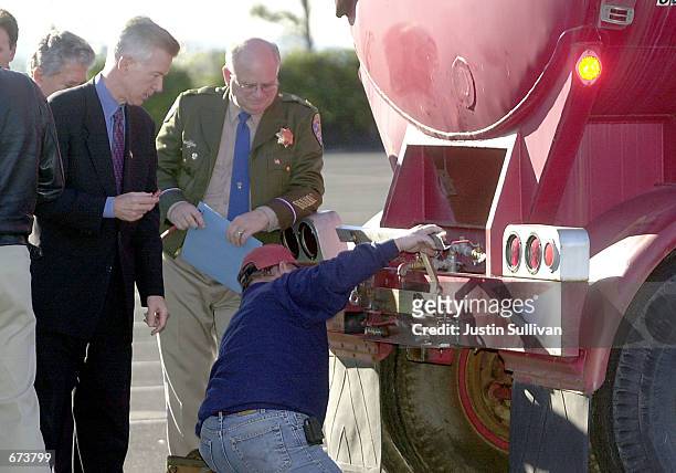 California Governor Gray Davis and California Highway Patrol Commisioner Dwight "Spike" Helmick watch Lawrence Livermore National Laboratory employee...