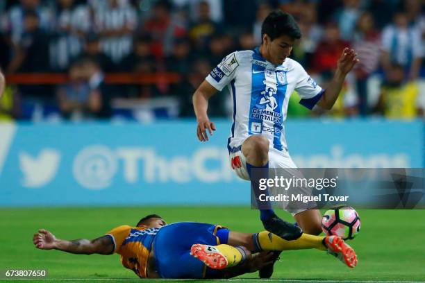 Erick Gutierrez of Pachuca fights for the ball with Victor Sosa of Tigres during the Final second leg match between Pachuca and Tigres UANL as part...