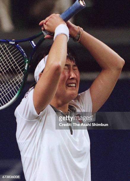 Ai Sugiyama of Japan celebrates winning against Mary Pierce of France during the Fed Cup World Group Quarterfinal between Japan and France at Arikake...