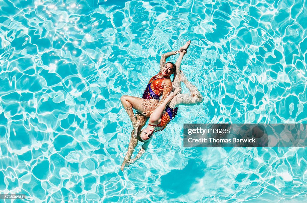 Synchronized swimmers performing routine