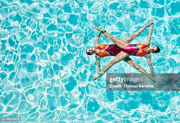 Synchronized swimmers performing routine