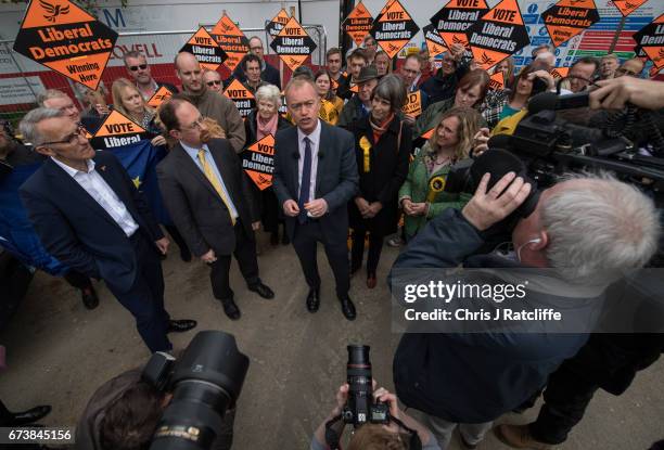 Liberal Democrats leader Tim Farron is seen beside Julian Huppert and Susan Van De Ven whilst campaigning for the British general election at...