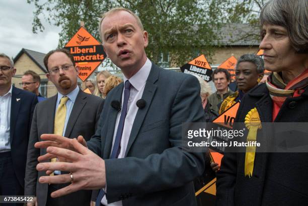 Liberal Democrats leader Tim Farron is seen beside Julian Huppert and Susan Van De Ven whilst campaigning for the British general election at...