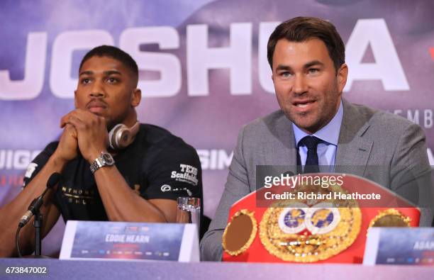Eddie Hearn, boxing promoter and Anthony Joshua speak during a press conference for his Super Heavyweight title fight against Wladamir Klitschko at...