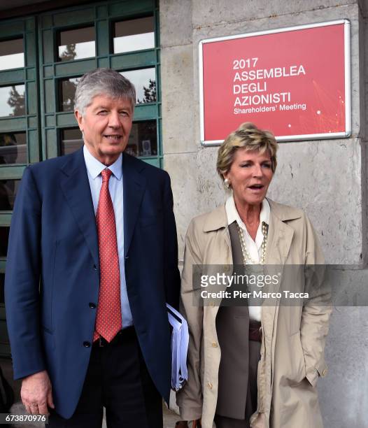 President of Generali Group Gabriele Galateri di Genola and his wife Evelina Christillin leave the Generali shareholders' meeting 2017 on April 27,...
