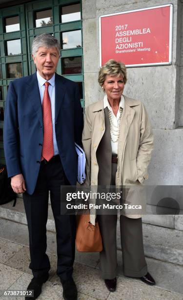 President of Generali Group Gabriele Galateri di Genola and his wife Evelina Christillin leave the Generali shareholders' meeting 2017 on April 27,...