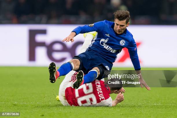 Leon Goretzka of Schalke and Nick Viergever of Ajax Amsterdam battle for the ball during the UEFA Europa League Quarter Final first leg match between...