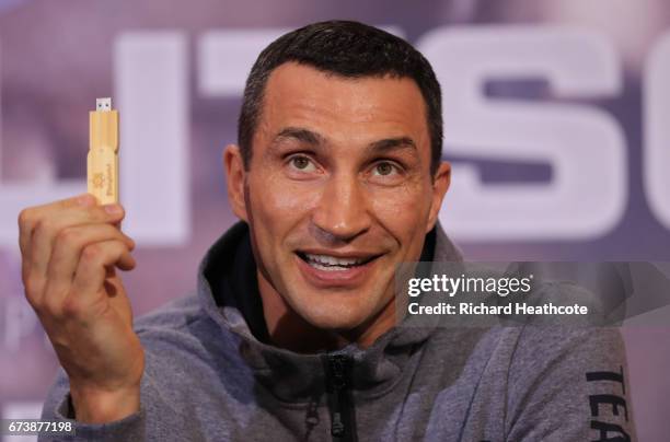 Wladamir Klitschko holds a USB stick containing his predictions for the fight during a press conference for his Super Heavyweight title fight against...