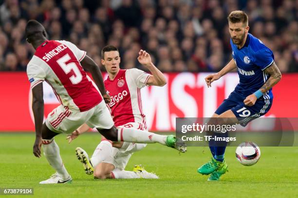 Davinson Sanchez of Ajax Amsterdam , Nick Viergever of Ajax Amsterdam and Guido Burgstaller of Schalke battle for the ball during the UEFA Europa...