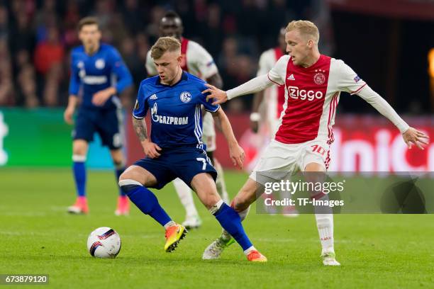 Max Meyer of Schalke and Donny van de Beek of Ajax Amsterdam battle for the ball during the UEFA Europa League Quarter Final first leg match between...