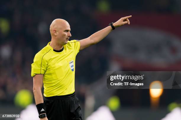 Referee Sergei Karasev, gestures during the UEFA Europa League Quarter Final first leg match between Ajax Amsterdam and FC Schalke 04 at Amsterdam...