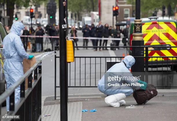 Forensic Officers collect evidence at the scene after a man was arrested following an incident on Whitehall St. On April 27, 2017 in London, England....