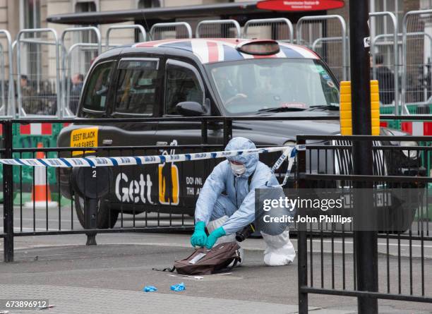 Forensic Officers collect evidence at the scene after a man was arrested following an incident on Whitehall St. On April 27, 2017 in London, England....
