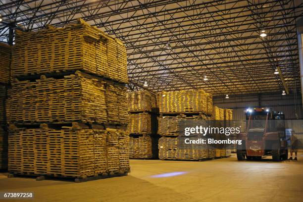 Pieces of white oak sit stacked inside a drying warehouse before being manufactured into bourbon barrels at the Brown-Forman Corp. Cooperage facility...