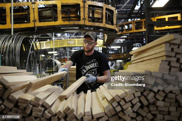 Factory worker selects white oak barrel staves to be manufactured into bourbon barrels at the Brown-Forman Corp. Cooperage facility in Louisville,...