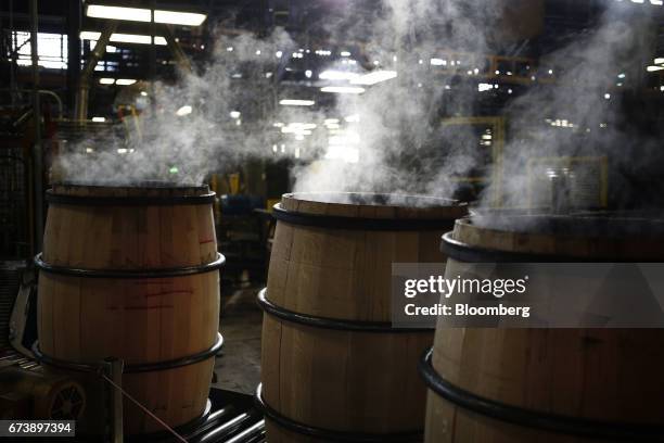 Smoke rises from bourbon barrels after being charred inside an oven at the Brown-Forman Corp. Cooperage facility in Louisville, Kentucky, U.S., on...