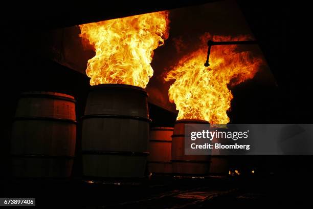 Bourbon barrels are charred inside an oven at the Brown-Forman Corp. Cooperage facility in Louisville, Kentucky, U.S., on Thursday, April 20, 2017....