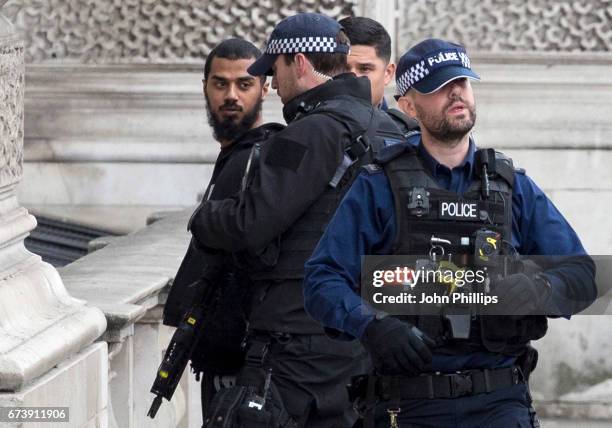 Man is detained by police officers near Downing Street, on Whitehall on April 27, 2017 in London, England. Multiple knives were seen at the scene...