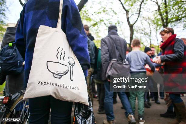 Homeless people receive a hot meal during 'Soup on Planty' event at Planty park in Krakow, Poland on 27 April, 2017. &quot;Soup on Planty&quot; is a...