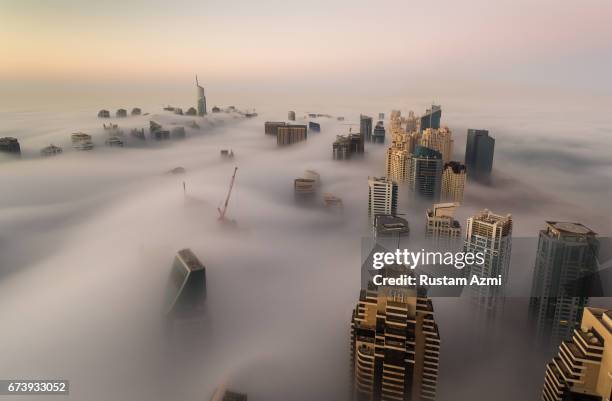 Aerial view of Foggy Morning of Dubai marina captured from 73rd floor of cayan tower on December 05, 2016 in Dubai, United Arab Emirates.