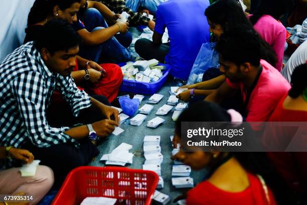 Workers prepare voters identity cards for the upcoming local election at the election commission in Kathmandu, Nepal on April 27, 2017. Nepal is...