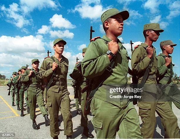 Cuban youths receive military training November 26, 2001 at the School of the Army "Camilo Cienfuegos" near Havana. Cuba has 15 schools of military...