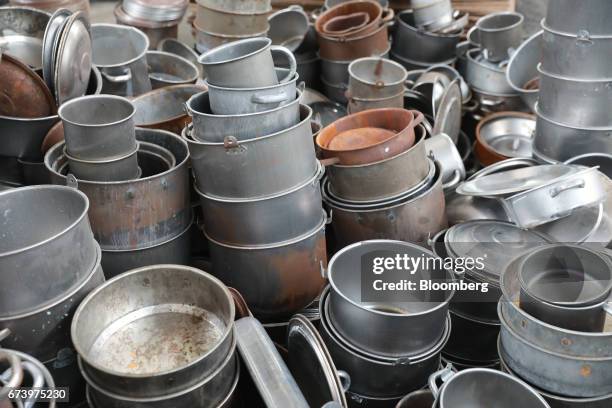 Pewter pots sit in a pile prior to the enamel process at the Baro Industrial SA manufacturing facility in the Azcapotzalco neighborhood of Mexico...