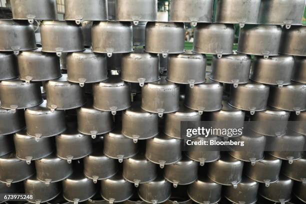 Pewter pots sit stacked at the Baro Industrial SA manufacturing facility in the Azcapotzalco neighborhood of Mexico City, Mexico, on Thursday, March...