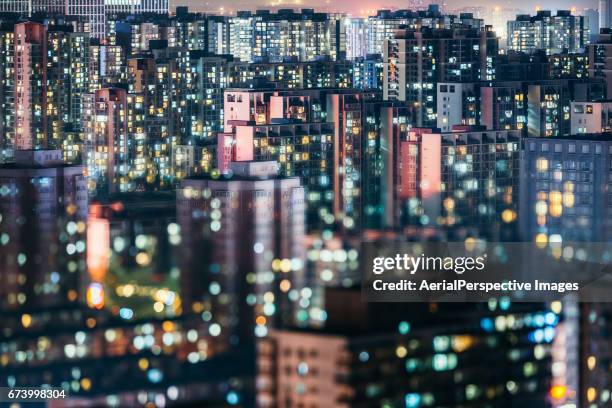 living apartment in beijing at night - crowded home stock-fotos und bilder