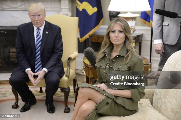 First Lady Melania Trump, left, and U.S. President Donald Trump sit for a meeting with Mauricio Macri, Argentina's president, not pictured, in the...