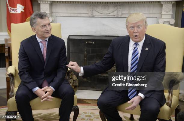 President Donald Trump, right, speaks while Mauricio Macri, Argentina's president, listens during a meeting in the Oval Office of the White House in...