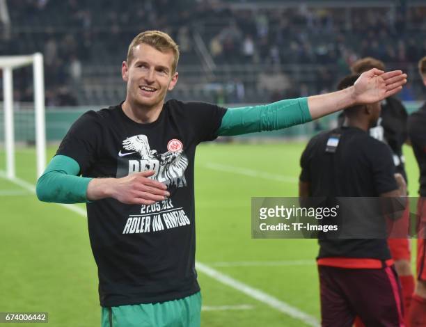 Goalkeeper Lukas Hradecky of Frankfurt elebrates with a team after the DFB Cup semi final match between Borussia Moenchengladbach and Eintracht...