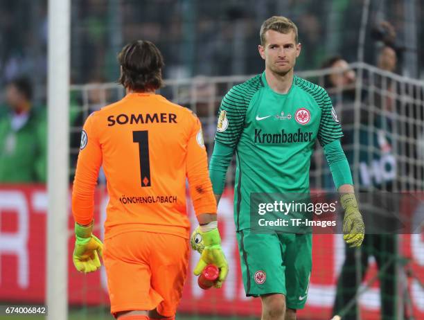 Goalkeeper Lukas Hradecky of Frankfurt and Goalkeeper Yann Sommer of Moenchengladbach looks on during the DFB Cup semi final match between Borussia...