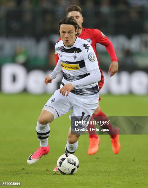 Nico Schulz of Moenchengladbach controls the ball during the DFB Cup semi final match between Borussia Moenchengladbach and Eintracht Frankfurt at...