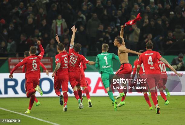 Players of Frankfurt celebrates with a team after during the DFB Cup semi final match between Borussia Moenchengladbach and Eintracht Frankfurt at...