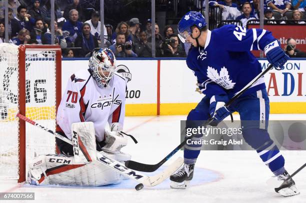 Braden Holtby of the Washington Capitals makes a save on Tyler Bozak of the Toronto Maple Leafs during the third period in Game Six of the Eastern...