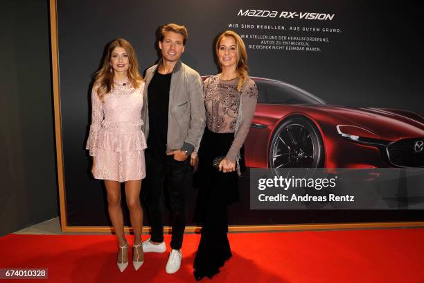 Cathy Hummels, Raul Richter and Charlotte Wuerdig attend the spring cocktail hosted by Mazda and InTouch magazine at Mazda Pop Up-Store on April 27,...