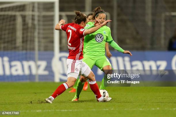 Gina Lewandowski of Munich and Vanessa Bernauer of Wolfsburg battle for the ball during the Women's DFB Cup Quarter Final match between FC Bayern...