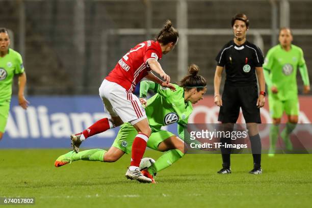 Gina Lewandowski of Munich and Vanessa Bernauer of Wolfsburg battle for the ball during the Women's DFB Cup Quarter Final match between FC Bayern...