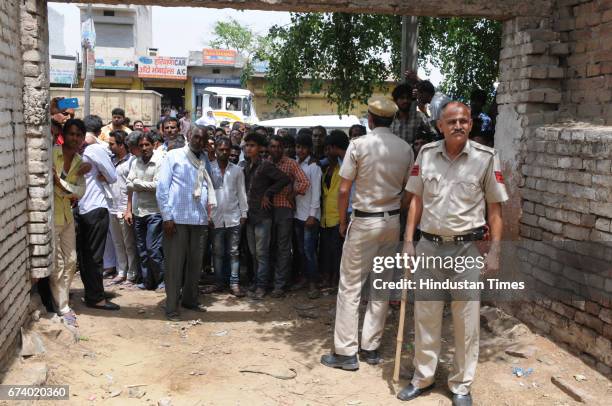 Police control the people after a leopard entered a house in Durga colony of Sohna, on April 27, 2017 some 25 km from Gurgaon, India.