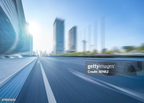 fast moving road in motion - fast motion stock pictures, royalty-free photos & images