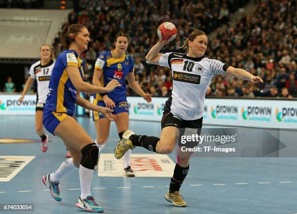 March 19: Marie Wall of Sweden and Carin Strömberg of Sweden and Anna Loerper of Germany battle for the ball during the match Germany vs. Sweden at...